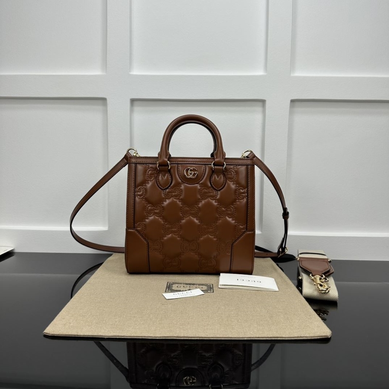 G*u*i top handle bags